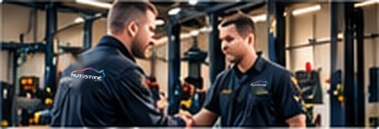Autostone director shaking hands with an independent garage owner